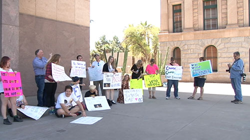 Reaction to SB 1062, a bill to let businesses cite religious belief as a defense against discrimination charges, has drawn protesters to the Capitol and led one Tucson pizzeria to threaten to refuse service to lawmakers. <b>Cronkite NewsWatch</b> has team coverage.